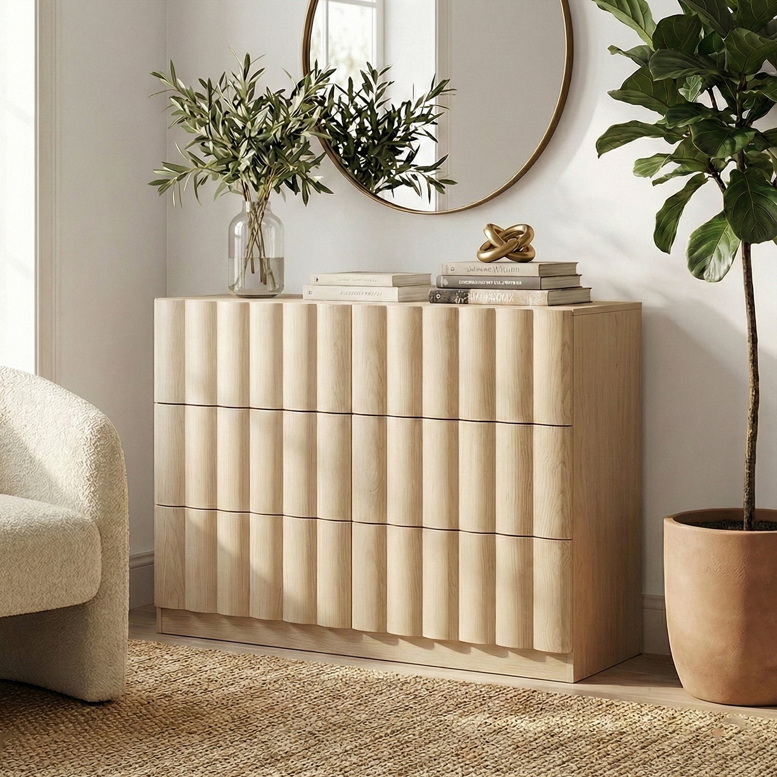 Light wood six-drawer dresser in a styled living space with mirror and decor