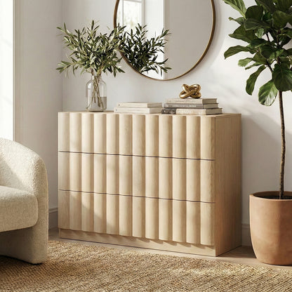 Light wood six-drawer dresser in a styled living space with mirror and decor