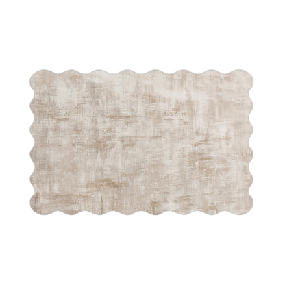 Whole scalloped-edge beige rug shown on a white background