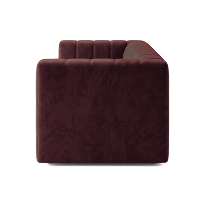 Side view of a Dark Merlot tufted sofa on a white background