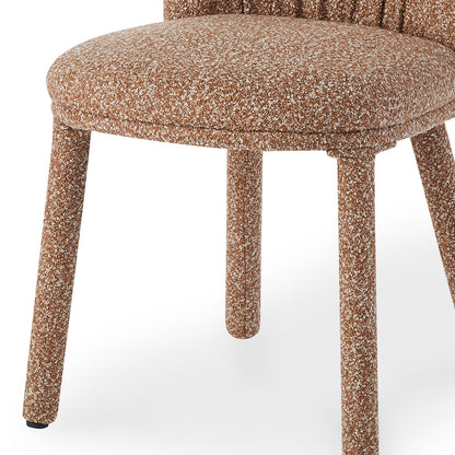 Joren Boucle Arched Dining Chair Set of 2 in Coral, featuring a round padded seat and four splayed legs, all enveloped in textured boucle fabric for modern elegance and comfort.