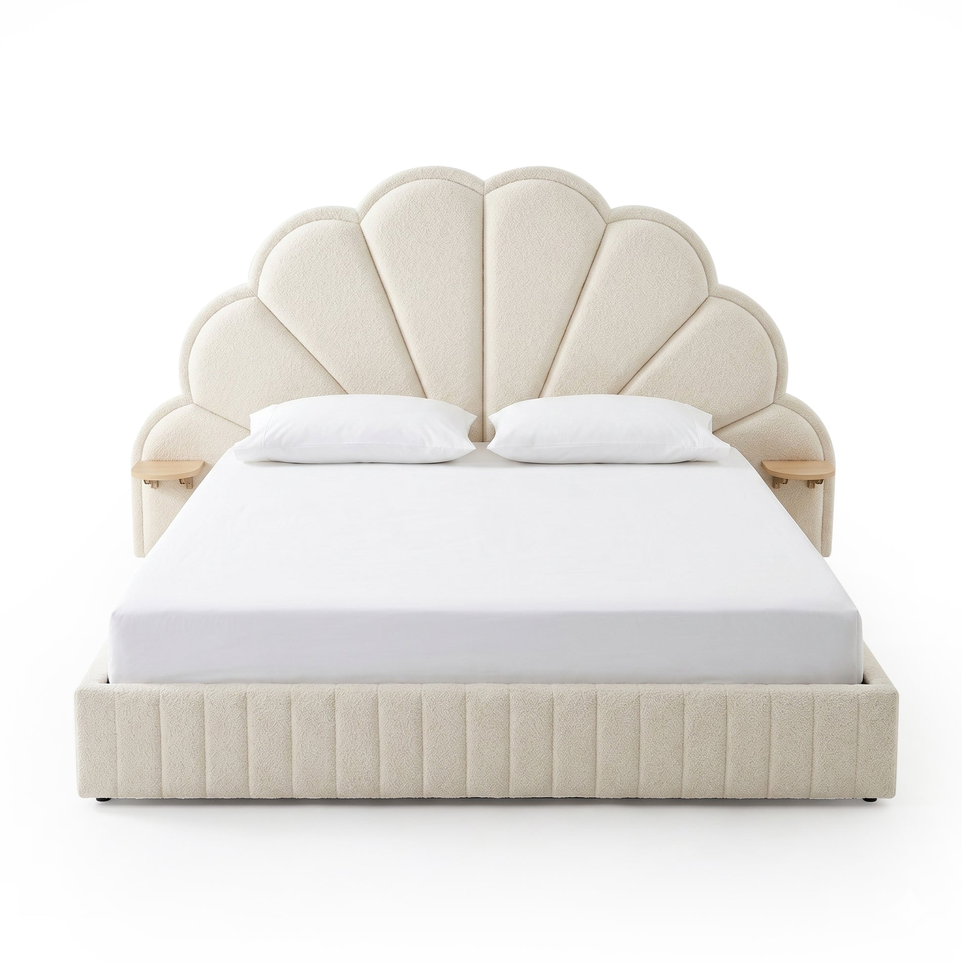 Upholstered scallop headboard bed with white bedding on white background