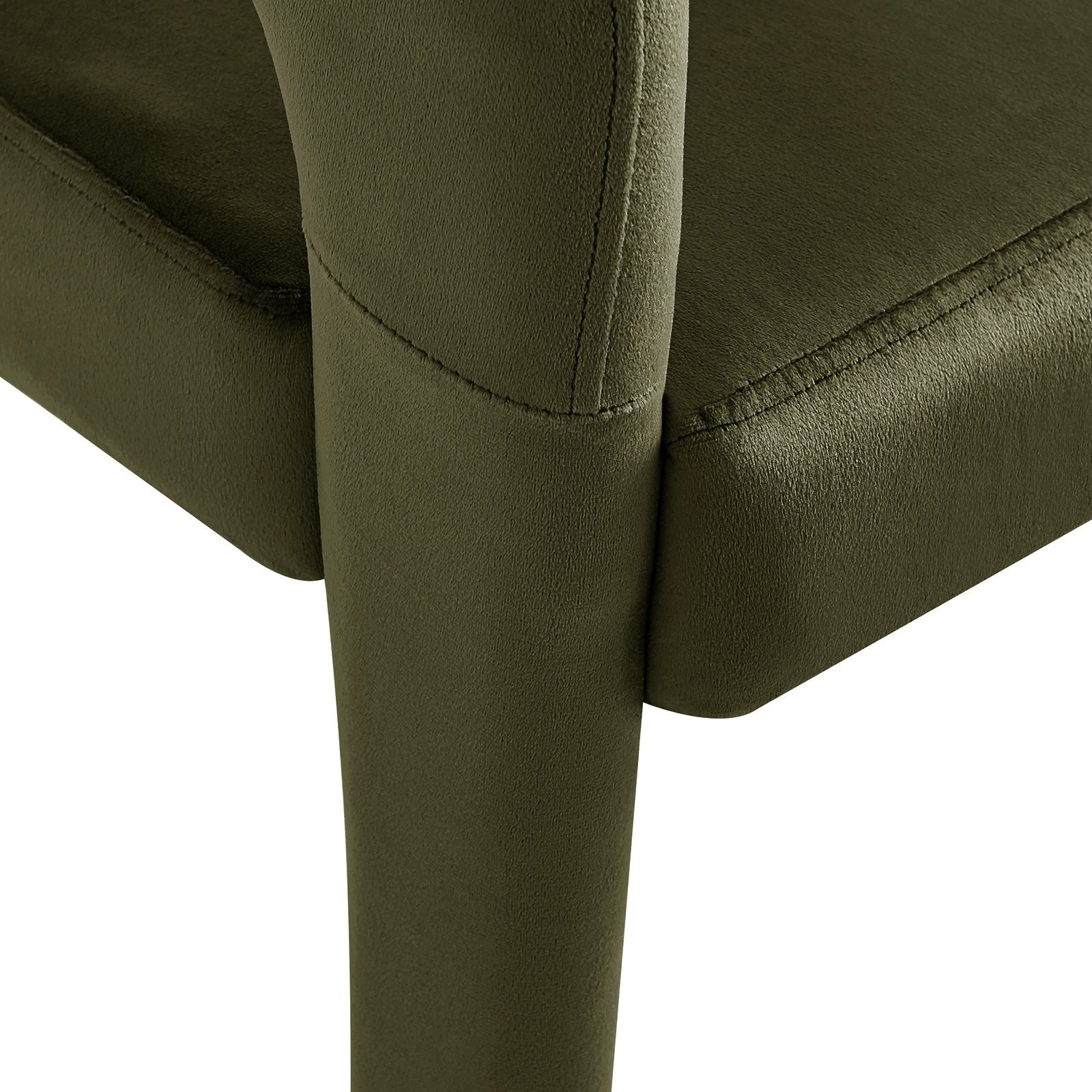 Close-up of Eisha Velvet Dining Chair Set of 2 in Woodland Green, showcasing plush olive-green upholstery and visible stitching, with a supportive vertical metal leg meeting the cushioned seat.