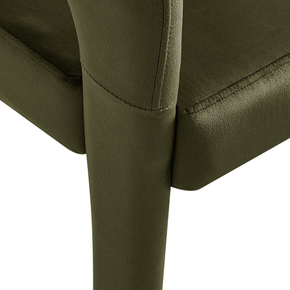 Close-up of Eisha Velvet Dining Chair Set of 2 in Woodland Green, showcasing plush olive-green upholstery and visible stitching, with a supportive vertical metal leg meeting the cushioned seat.
