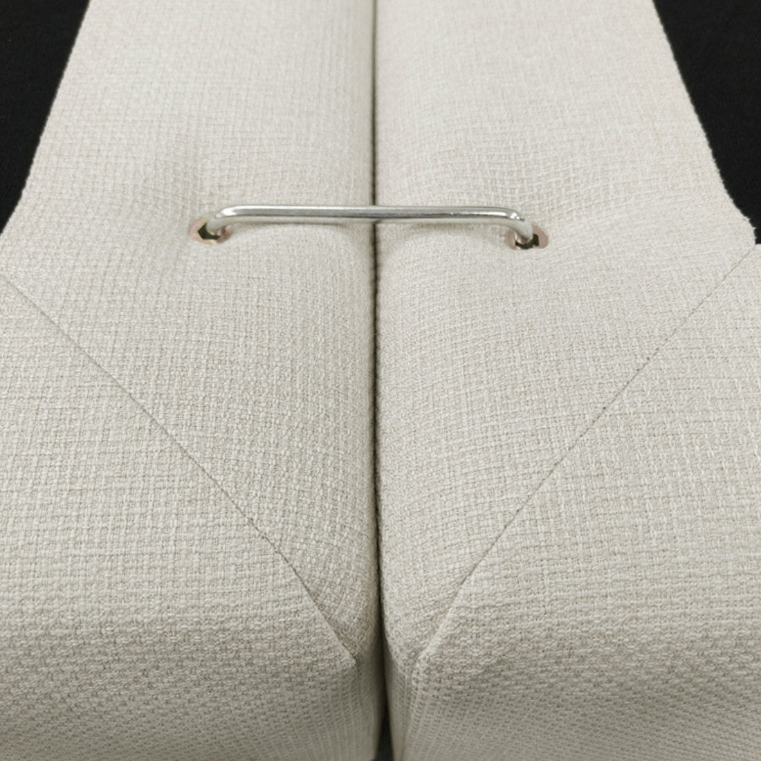 Close-up of upholstered furniture connector and fabric texture