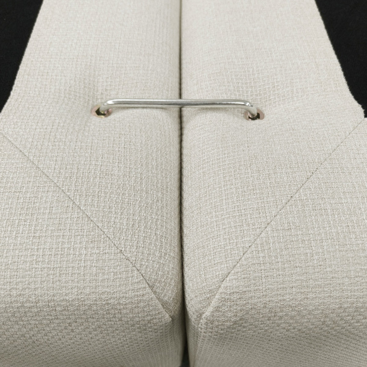 Close-up of upholstered furniture connector and fabric texture