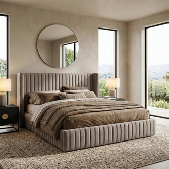 Taupe upholstered channel-tufted bed styled in a bright contemporary bedroom