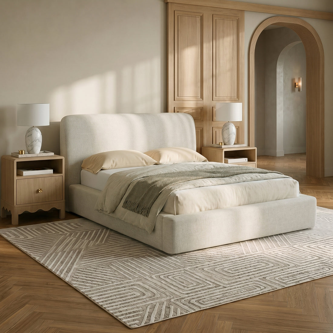 Upholstered bed styled in a warm modern bedroom with nightstands and lamps