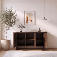 Dark wood sideboard with open cabinet doors in a styled room