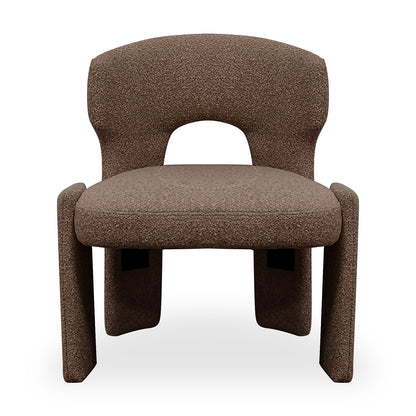 Lunari Bouclé Curved Accent Chair in Brown features a sculptural design with a curved seat, rounded backrest with a cut-out, and thick legs, exuding modern elegance and comfort.