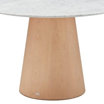 Dina 120cm Round Marble Dining Table in Carrara Natural features a round marble tabletop with unique veining atop a conical, light-finished wooden pedestal base, offering elegance and stability for dining spaces.