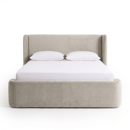 Full upholstered bed photographed on a white background