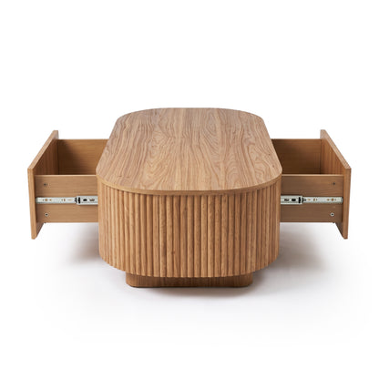 Oval wooden coffee table with both side drawers open on a white background
