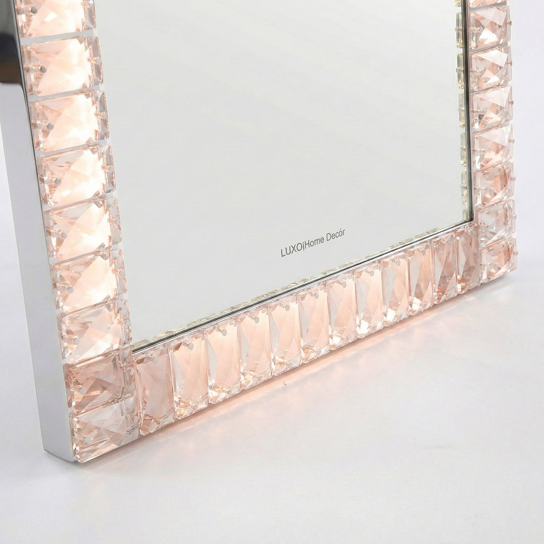 Close-up of faceted gem-like mirror frame detail