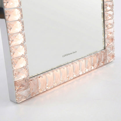 Close-up of faceted gem-like mirror frame detail