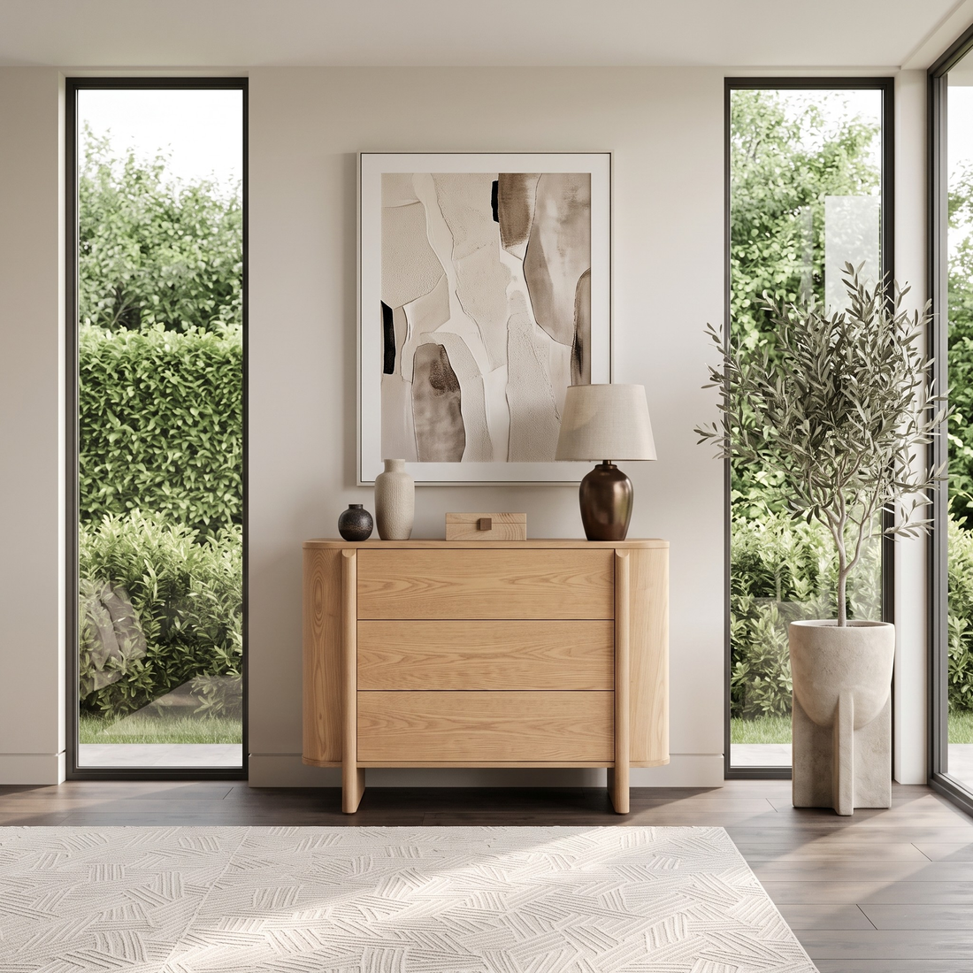 Wooden sideboard in a bright modern room with windows and decor