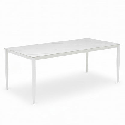 Cabria 9 Piece Sintered Stone Outdoor Dining Set features a sleek, minimalist table with a faux-marble top and slim white frame, complemented by eight cushioned chairs for stylish alfresco dining.