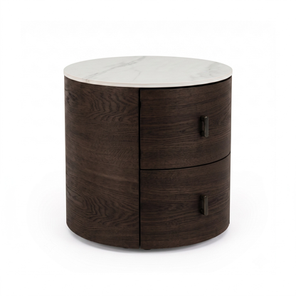 Modern round side table with dark wooden base and light marble-like top on a white background.