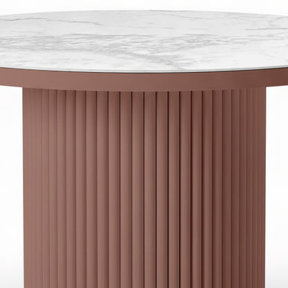 Evone Aluminium Outdoor Dining Table in Terracotta with a round white marble-look top featuring gray veining, supported by a cylindrical, fluted terracotta base, designed for outdoor durability and style.