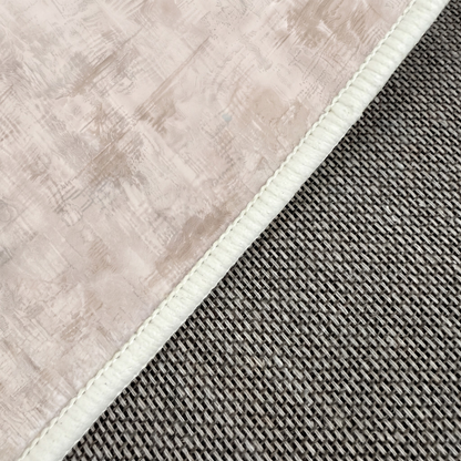 Close-up of the rug edge showing stitching and textured material detail.