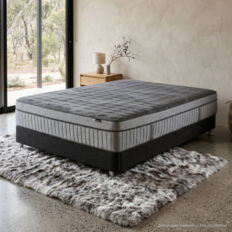Gray mattress and base in a stylish bedroom setting
