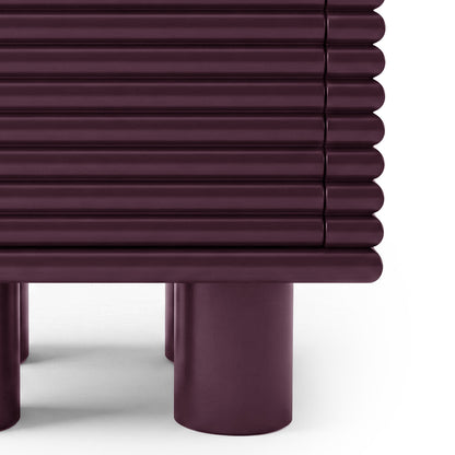 Close-up of base and ribbed detail of burgundy side table on white background