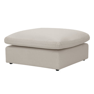 Square light beige ottoman on a white background with a thick cushion top.