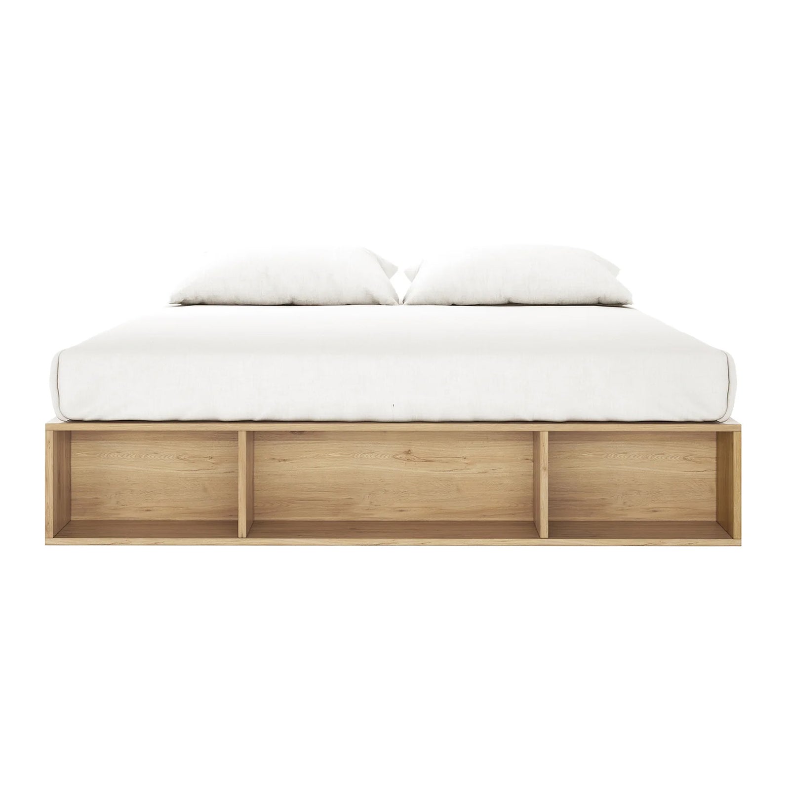 Eulalia King Platform Bed Base with Drawers in Oak features a sleek, low-profile design with a light wood base, white mattress, and pillows, plus three open shelves for storage.