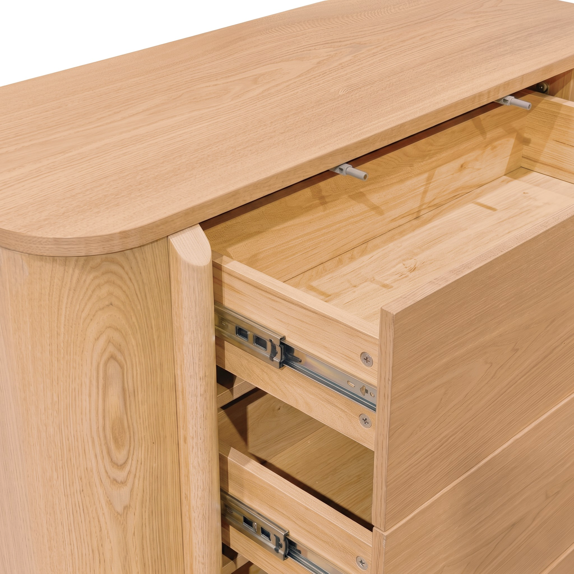 Close-up of a light wood dresser with partially opened drawers