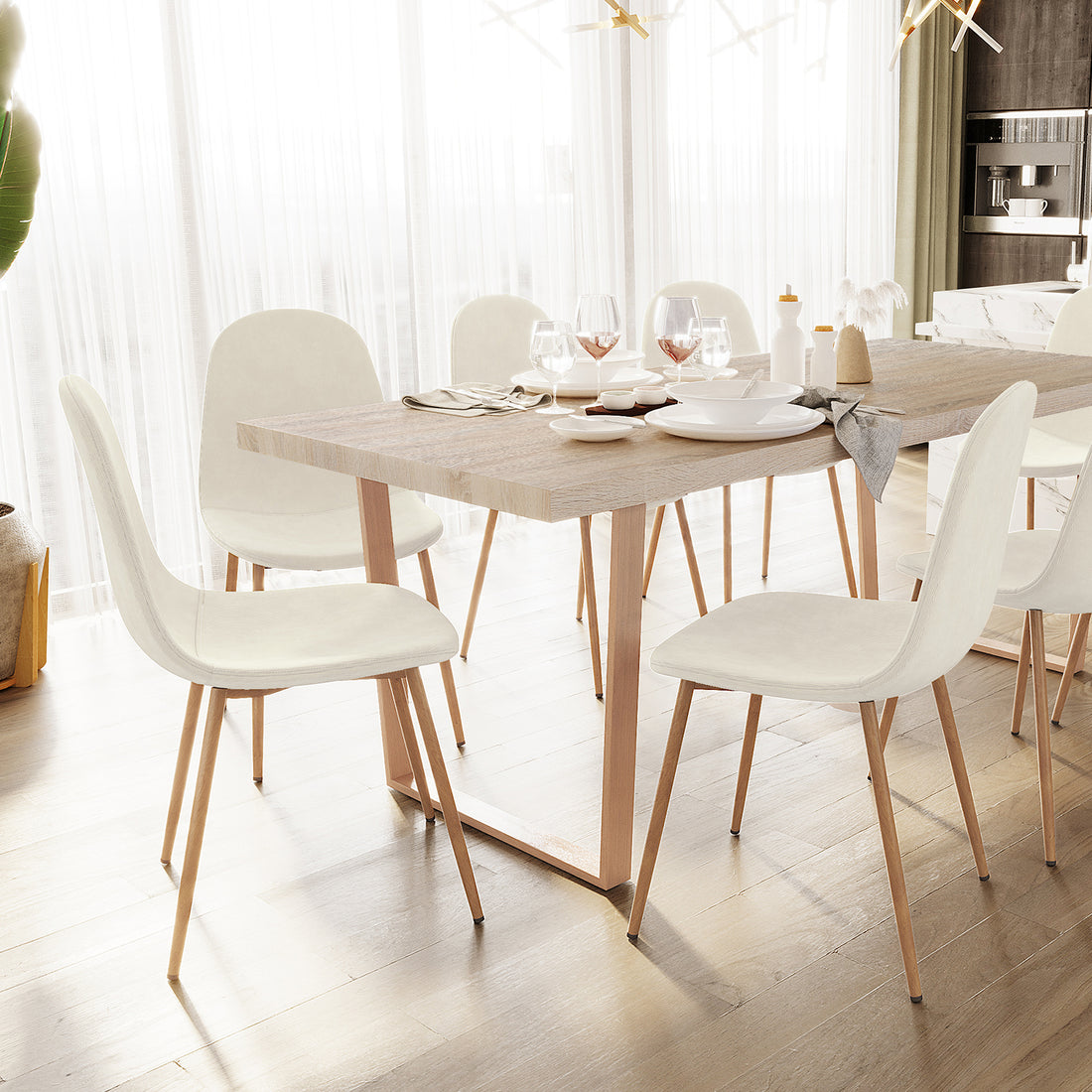 Florida Corduroy Fabric Dining Chairs Set of 4 in Sand, featuring sleek white upholstery and angled wooden legs, arranged around a light-wood table in a bright, modern dining space.