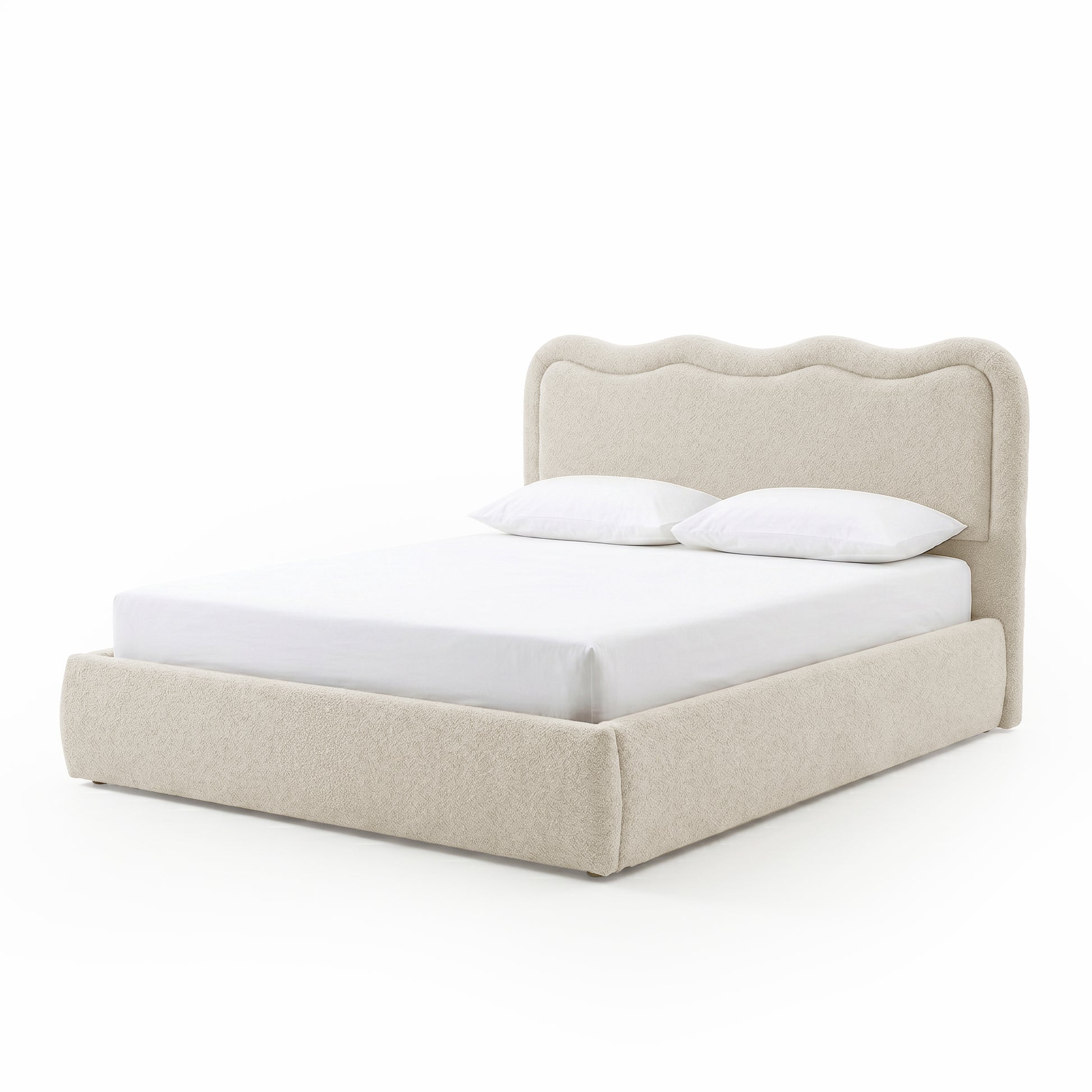 Modern upholstered bed with scalloped headboard on white background