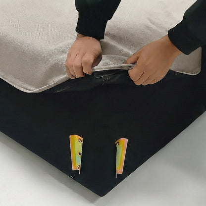 Hands unzipping a beige fabric cover at the corner with metal brackets