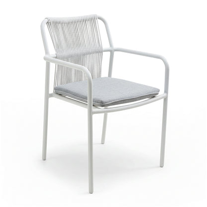 Evone 4 Seater Stone Outdoor Dining Table Set features a sleek stone tabletop with a sturdy aluminum frame and four modern armchairs, each with a white cord backrest and light-gray cushion.