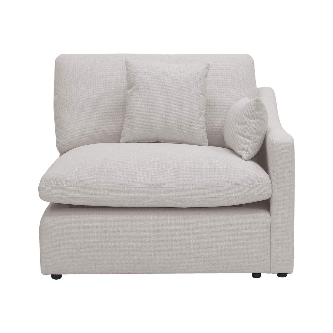 Light beige armless sectional chair with pillows on a white background