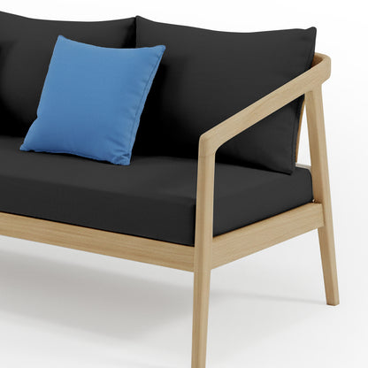 Delva 4 Seater Hardwood Acacia Outdoor Sofa Set in Black, featuring a modern two-seat section with light wood frame, thick black cushions, and a bright blue throw pillow against a white background.