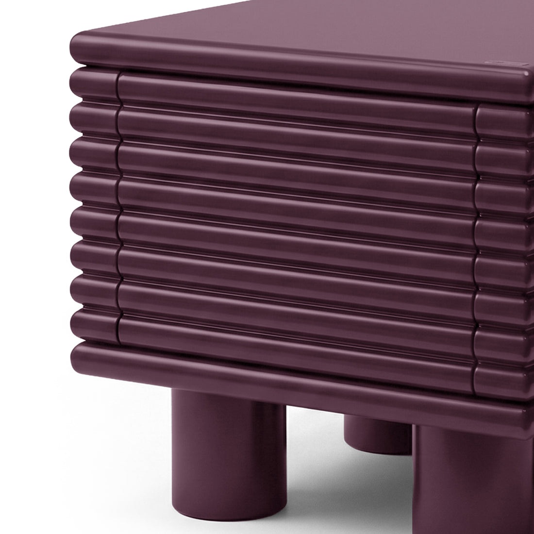Close-up of top corner and ribbed surface of plum side table