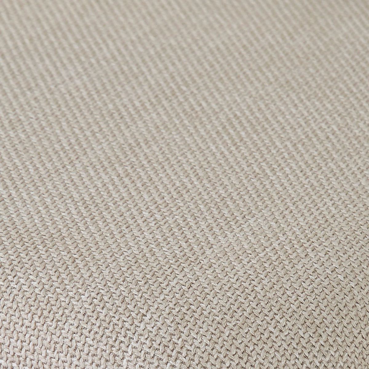 Extreme close-up of beige woven fabric texture.
