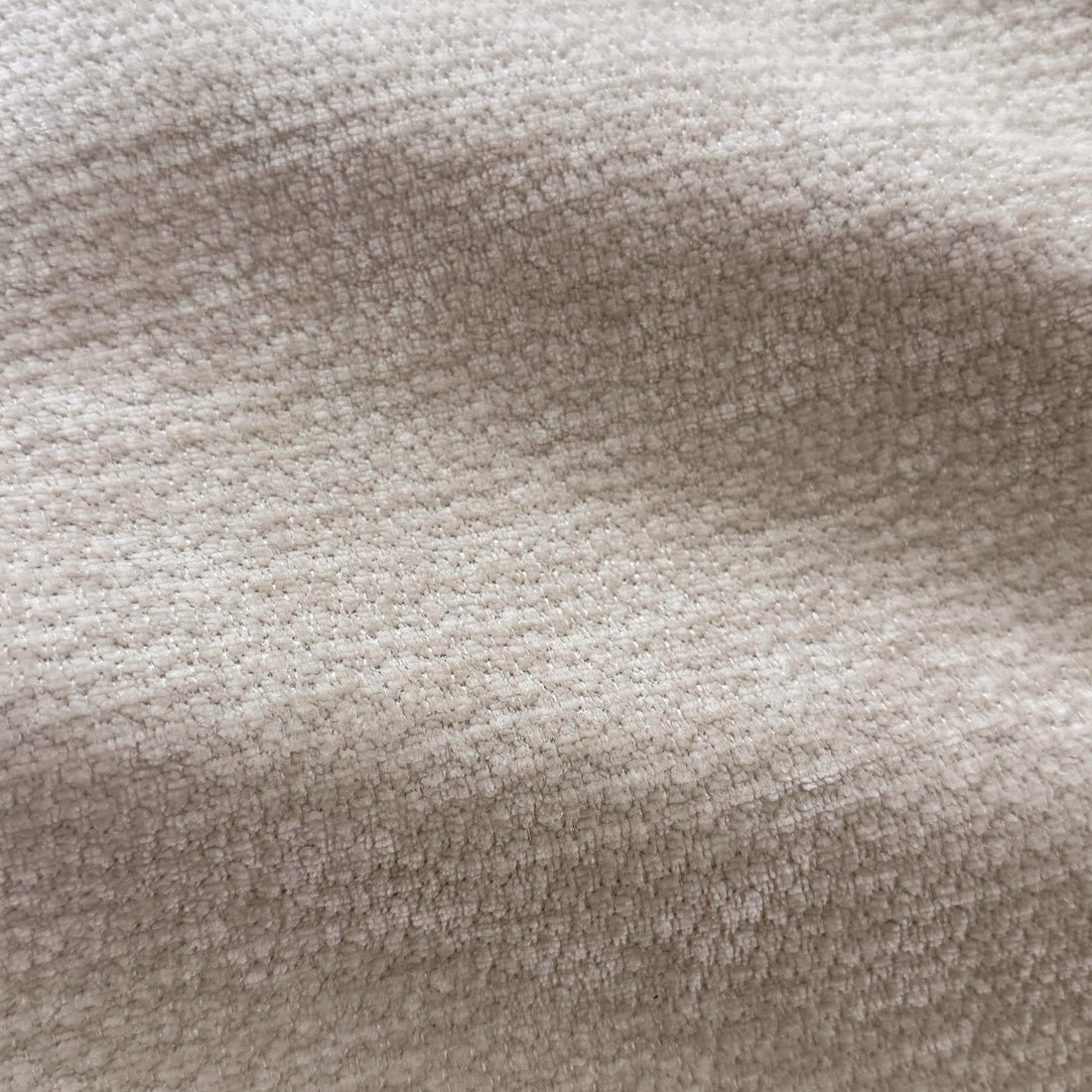 Close-up macro view of beige woven fabric texture.