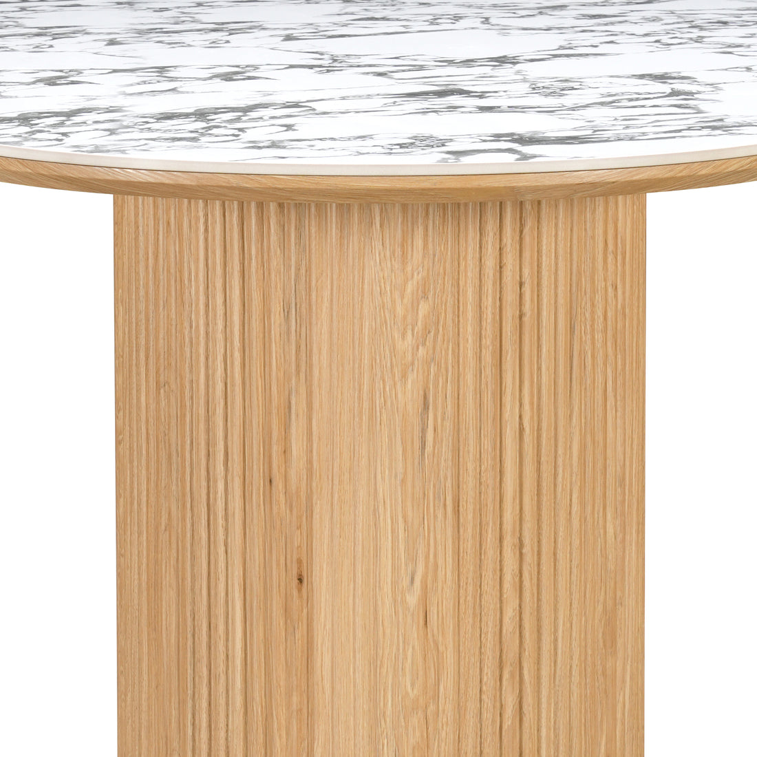 Close-up of marble-effect tabletop and light wood grooved base on a white background