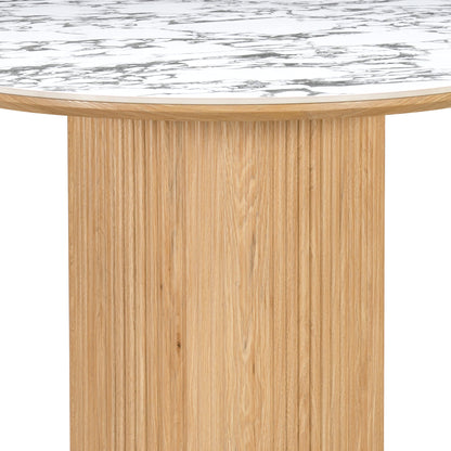 Close-up of marble-effect tabletop and light wood grooved base on a white background