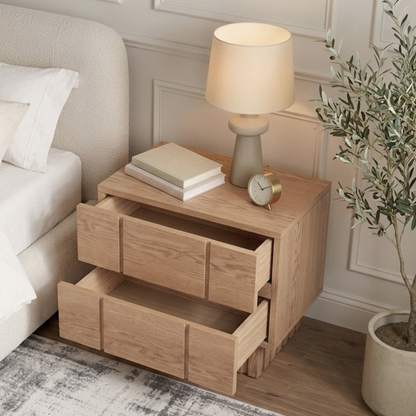 Wooden nightstand in a styled bedroom with decor