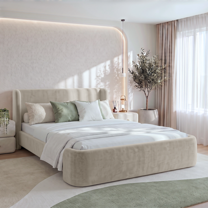 Upholstered bed styled in a modern bedroom with bedding and decor