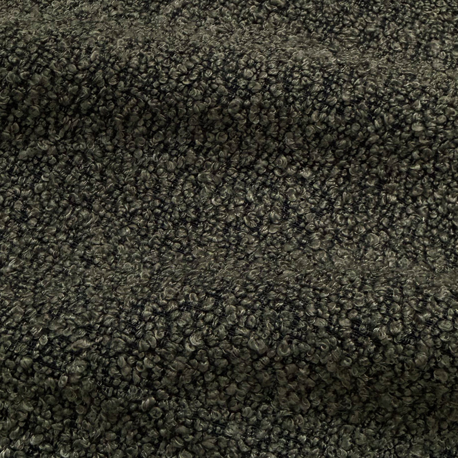 Extreme close-up of dark gray boucle fabric texture