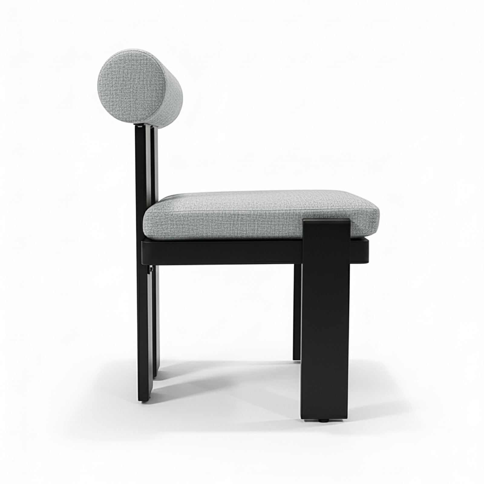 Positano 6 Seater Outdoor Dining Set in Black & Grey features a sleek, minimalist chair with a black metal frame, light-gray cushions, and a cylindrical backrest, embodying modern outdoor elegance.