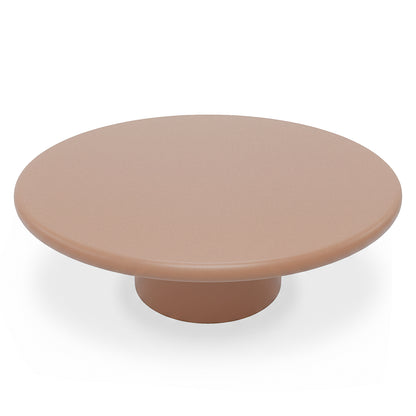 Round low-profile pedestal table on white background