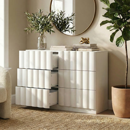 White six-drawer dresser with partially open drawers in a modern room setting