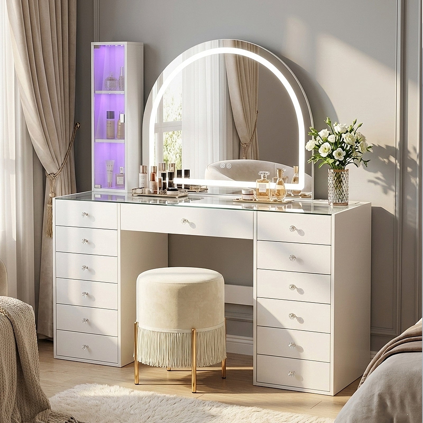 White vanity table with LED mirror and stool in a styled living room setting