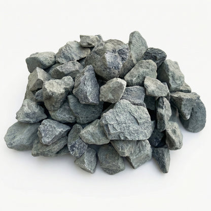 Neatly arranged pile of grey decorative stones on a white background