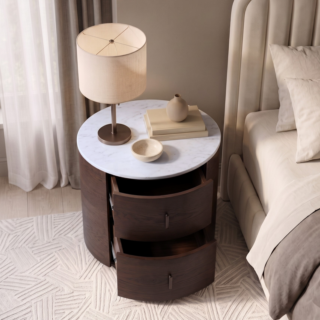 Round dark wood bedside table with marble-look top in a cozy bedroom setting.