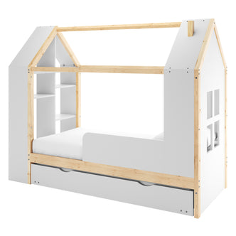 Halden Kids Cubby Bed Storage & Trundle features a house-shaped frame with natural wood posts, white panels, built-in cubby shelves, a pull-out drawer, and a guardrail for safety.